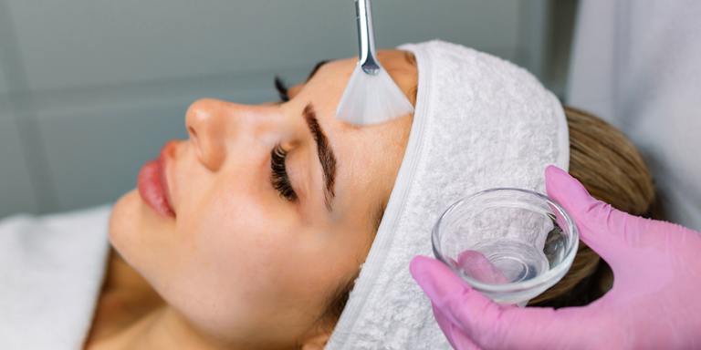 Client receiving a chemical peel treatment at AURSPA in Middleburg, FL, for skin rejuvenation