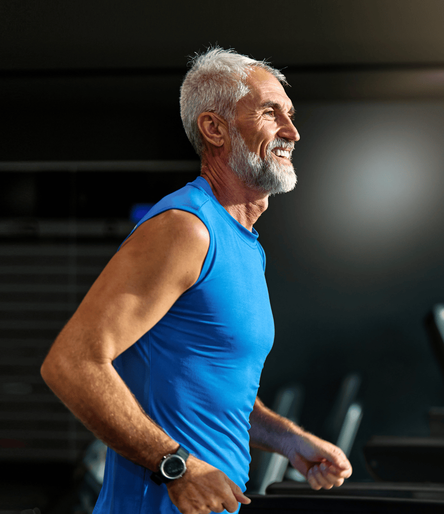 Confident, active man enjoying improved vitality and wellness after a personalized testosterone replacement therapy consultation at AURSPA in Oakleaf Plantation, Florida.