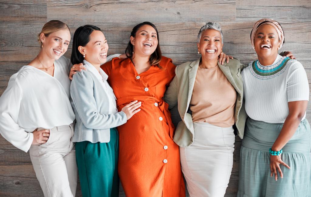 Confident, smiling woman enjoying renewed energy and wellness after personalized female bioidentical hormone replacement therapy at AURSPA in Oakleaf Plantation, Florida.