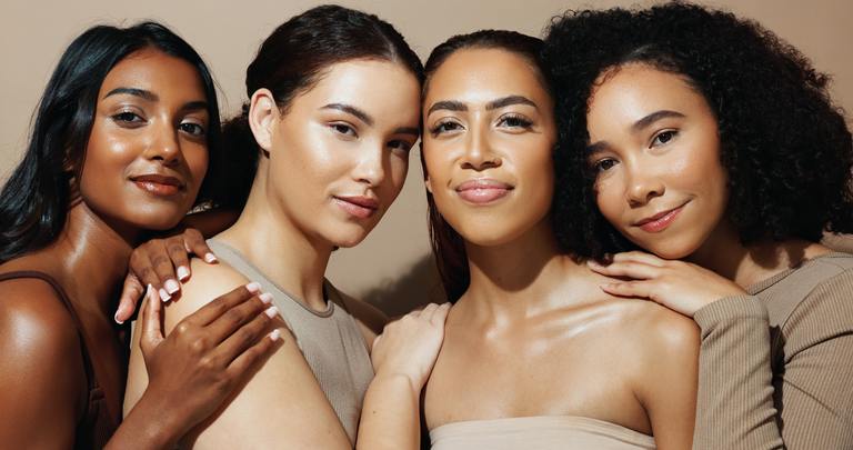 Group of women with healthy, glowing skin after professional facial treatments at AURSPA in Oakleaf Plantation, FL.